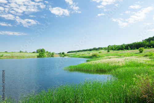 Fototapeta Naklejka Na Ścianę i Meble -  Landscape with pond and hills