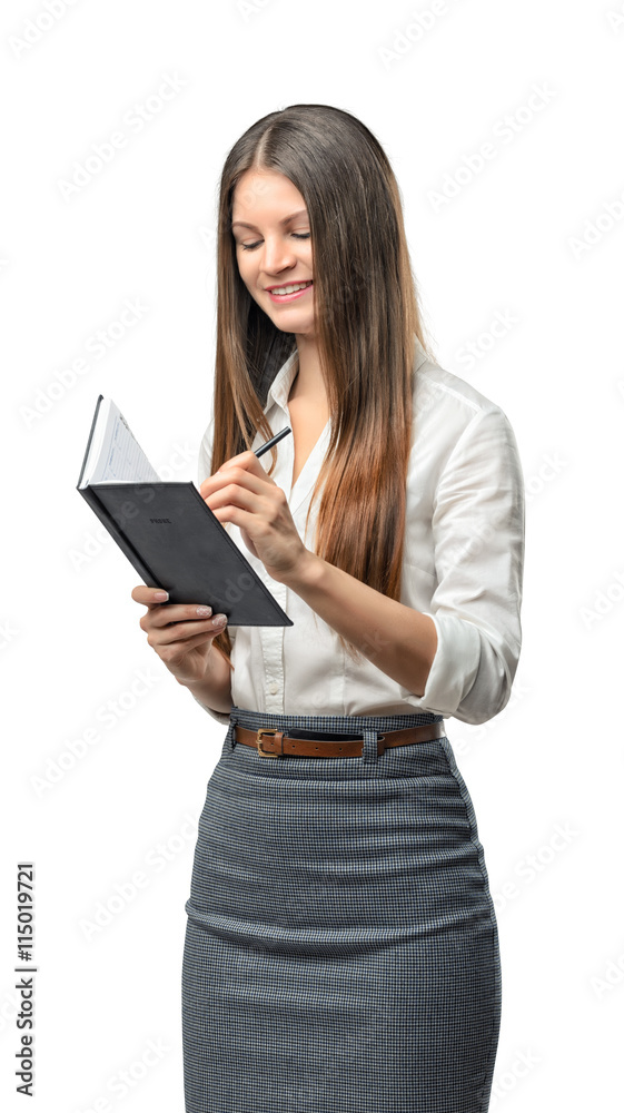 Cutout business woman writes something in notebook Cutout business woman writes something in notebook