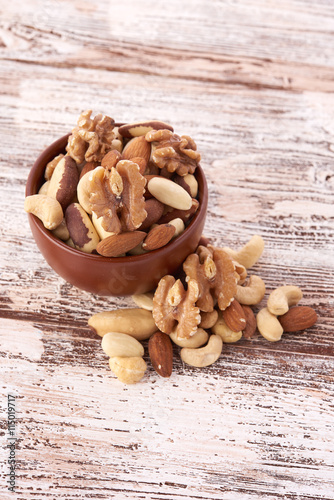 Mix nuts on wooden background