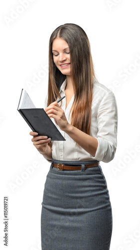 Cutout business woman writes something in notebook