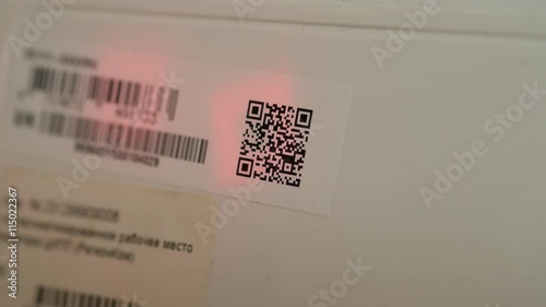 Close up of a 2d barcode reading with a barcode reader, 4k UHD 2160p, dolly slider shot photo