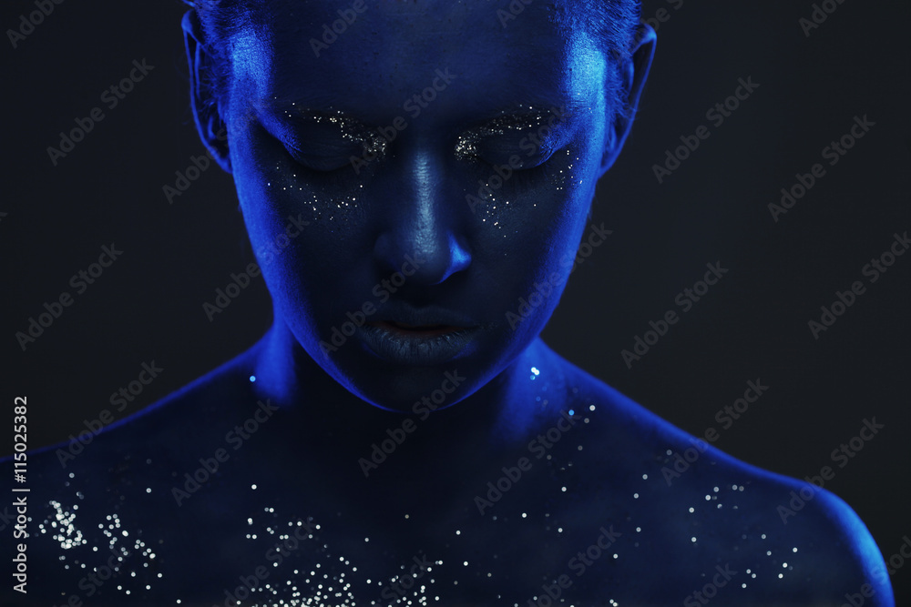 woman with dark blue face woman with dark blue face