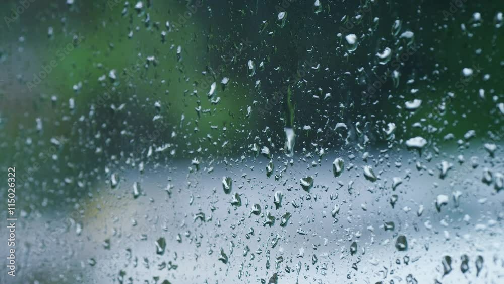 4K A single raindrop slides down the exterior of a window as it rains outside 4K A single raindrop slides down the exterior of a window as it rains outside