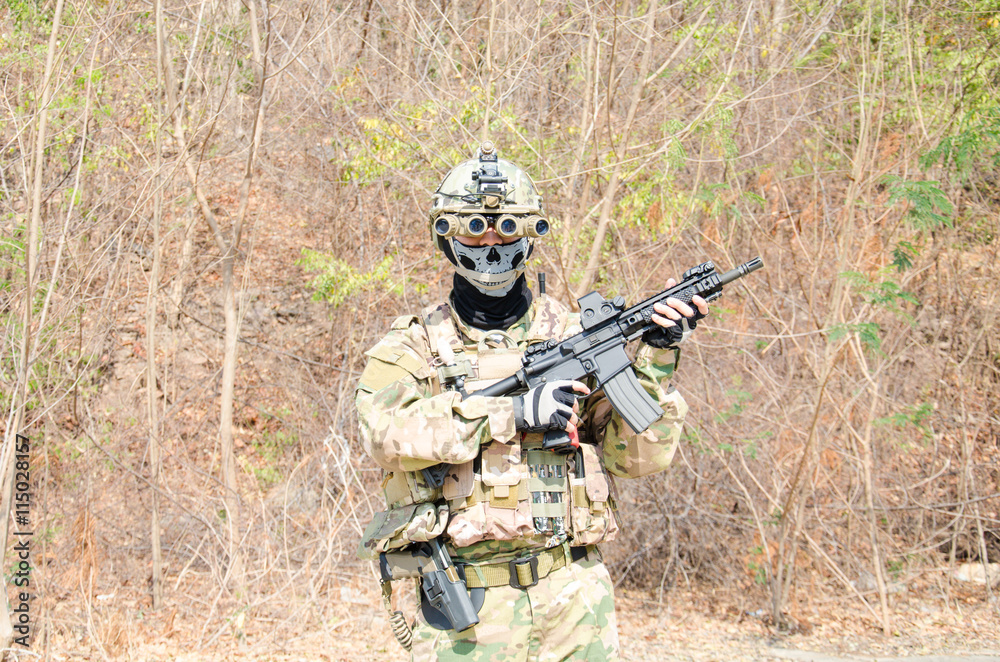 Fototapeta premium Portrait of men in action Airsoft gun.