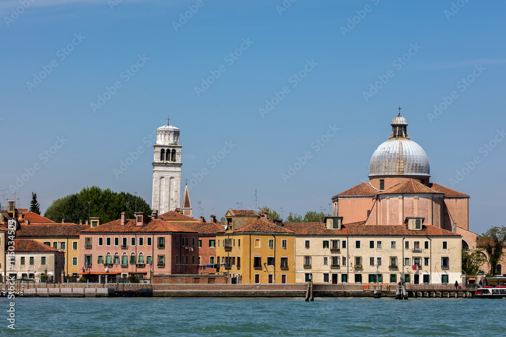 16th century Basilica of St Peter of Castello with it's leaning campanile made of white Istrian stone, located in the Castello district of Venice.