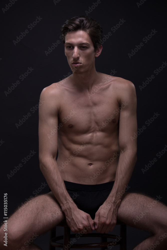 Nude young man posing model sitting Caucasian skinny, slim, fit