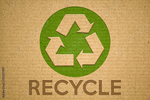 Recycle green symbol on cardboard with text recycle