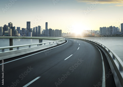 Highway overpass motion blur with city background .