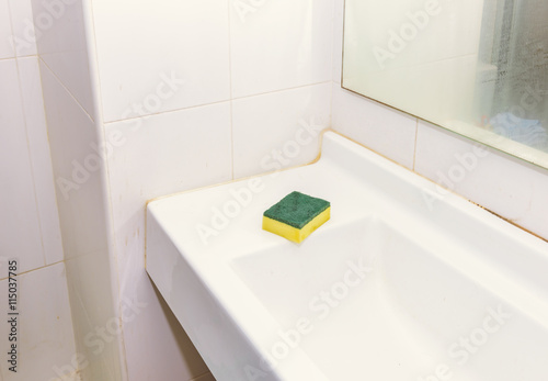 Bathroom sink with a sponge