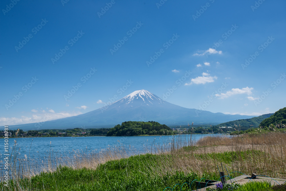 Mountain Fuji and lake kawaguchiko with tourist on the boat