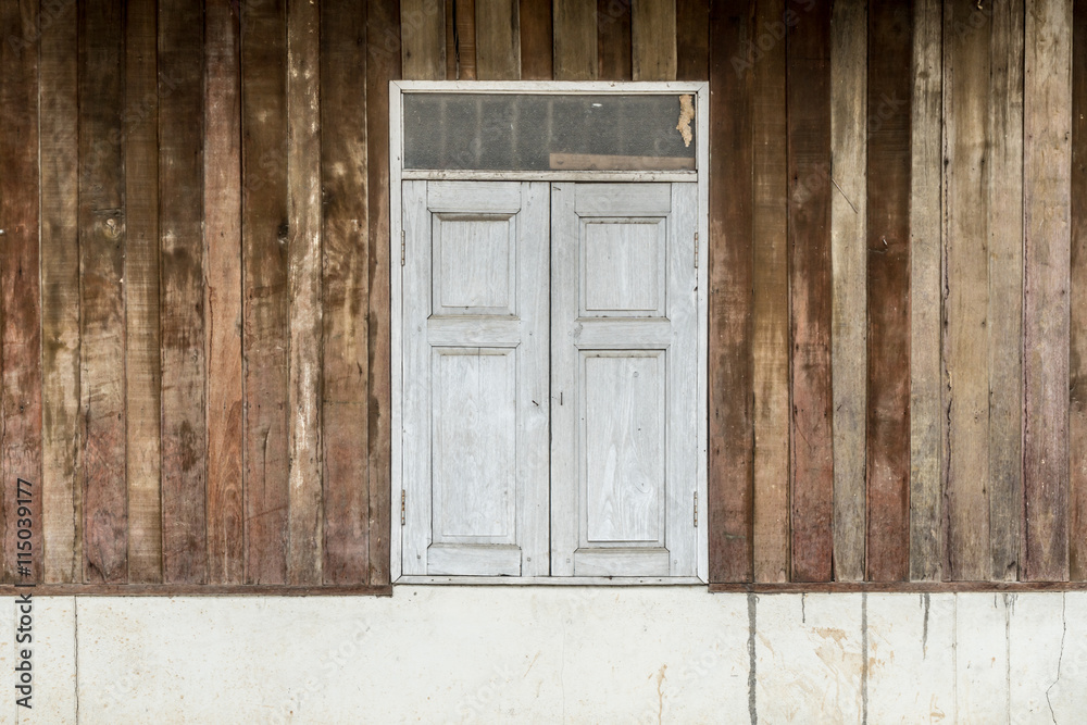 Windows on old wooden wall