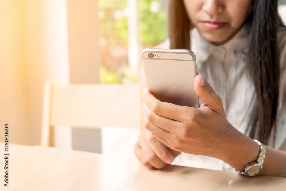 Beautiful woman using mobile or smart phone