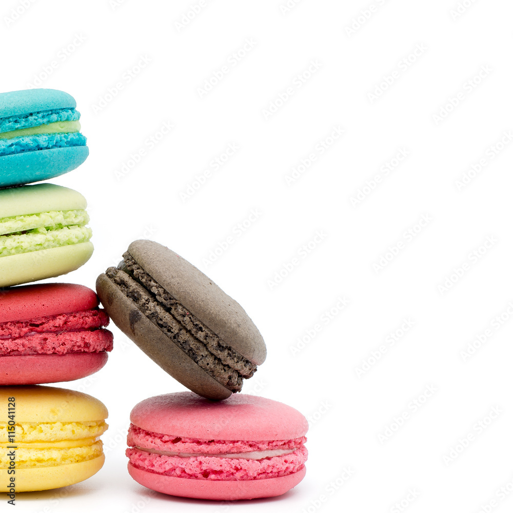 Sweet and colourful french macaroons or macaron on white backgro Sweet and colourful french macaroons or macaron on white backgro