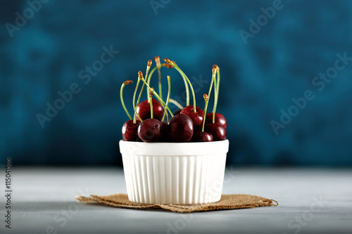 cherries with water drops on a blue background