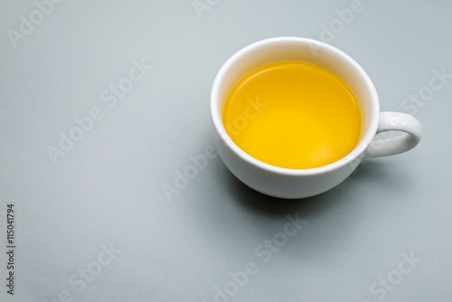 white Tea cup on Gray colour background.