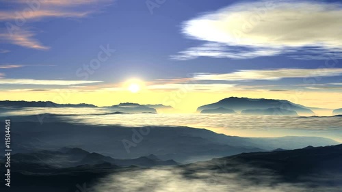Bright sunrise over the foggy valley. The morning blue sky pink and white clouds. Due to foggy horizon rises bright white sun.
