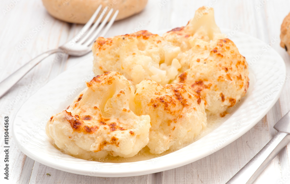 home cooked cauliflower stew in white tray on wooden home cooked cauliflower stew in white tray on wooden