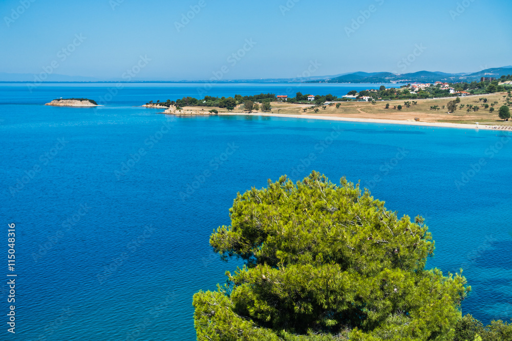 Greek mediterranean coast with beautiful blue tones of Aegean sea in Sithonia, Greece