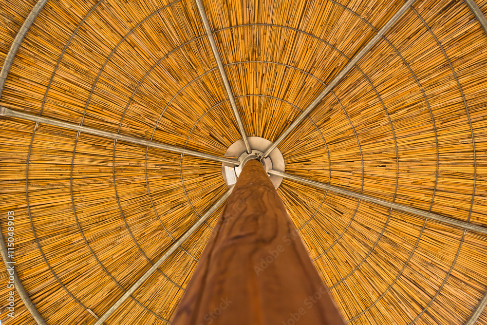 Straw parasol closeup from below in Sithonia, Greece