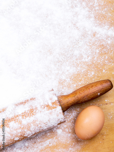 baking background with pastry board, rolling pin and egg