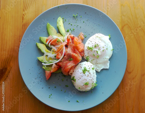 Poached eggs with avocado, tomato, red onion and smoked salmon