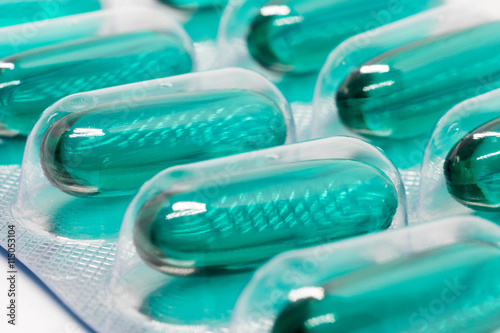 green soft gel capsules pills in blister pack