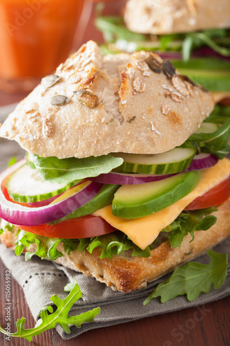 tomato avocado cheese sandwich with cucumber onion