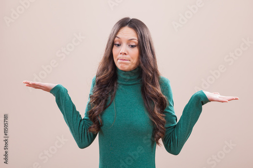 Photos Portrait of young woman who is saying that she does not know