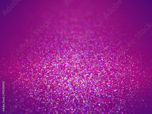 colorful glitter in shades of pink, purple, blue and white on a surface with a spotlight and depth of field effect (3D illustration)