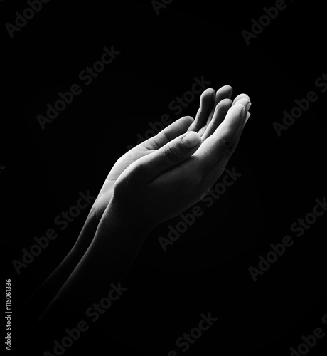 Black and white muslim hands dua to Allah over meadow sunset background  photo