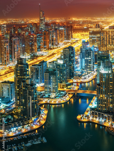 Fantastic rooftop skyline  illuminated architecture of a big city. Dubai Marina by night  United Arab Emirates.