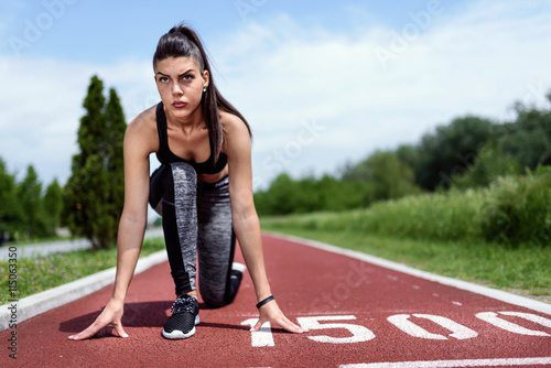 Woman Runner At Start Line