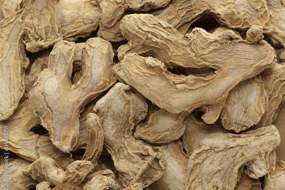 Organic dry Ginger root or Sonth (Zingiber officinale). Macro close up background texture. Top view.