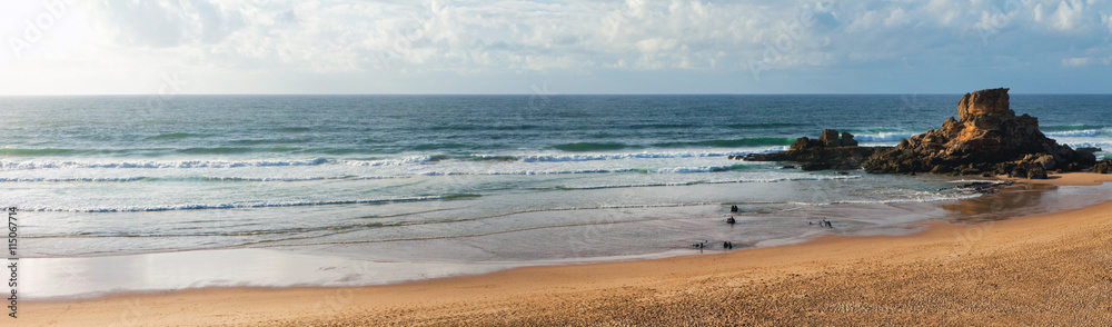 Panorama of the coast of the Atlantic Ocean on a sandy beach Castelejo during the evening tide, Sagres, Algarve, Portugal