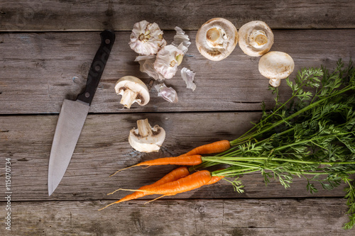 Ingredients for cooking: mushrooms, carrots and garlic photo