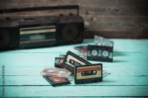 old cassette tape and player on the wood background