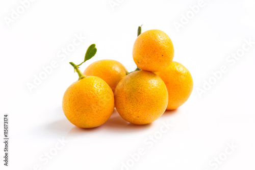 Orange Kumquat placed on whte background