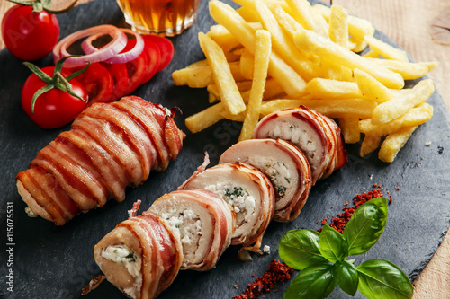 chicken breast stuffed feta cheese and herbs wrapped in bacon photo