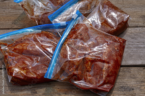 Obraz na plátně Marinated Meat with barbecue sauce