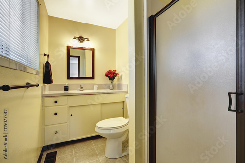 Beige bathroom interior with tile floor
