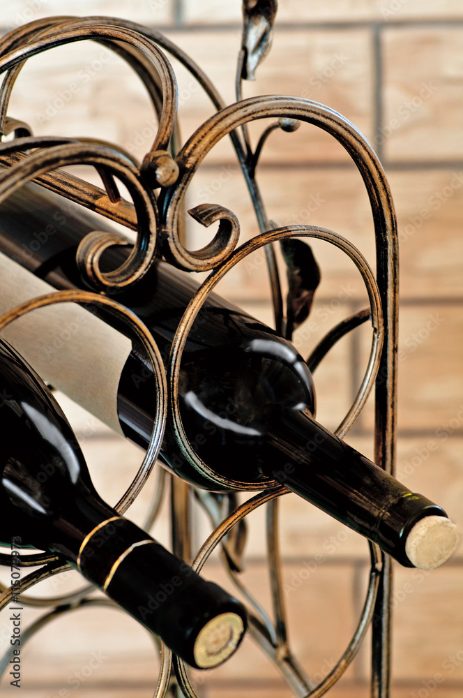 two bottles of red wine in holder two bottles of red wine in holder