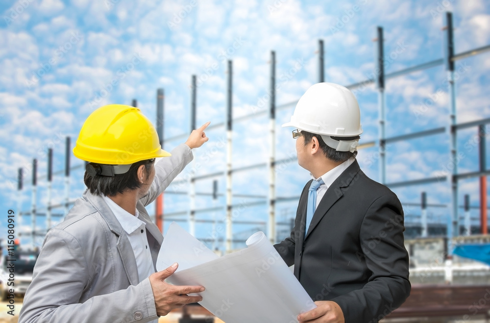 Engineer and foreman looking at blueprints Engineer and foreman looking at blueprints