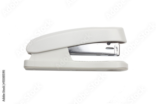 White and metal stapler over a white background photo