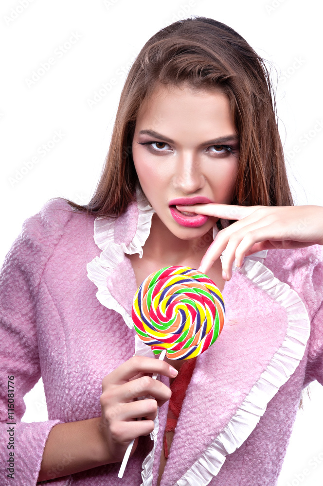 Portrait of a beautiful girl with big lollipop.