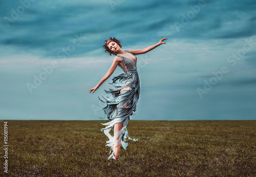 Bild auf Leinwand Girl muse, dancing in a field