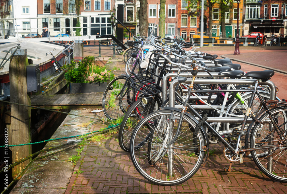 bicycles next to canal of Amsterdam 