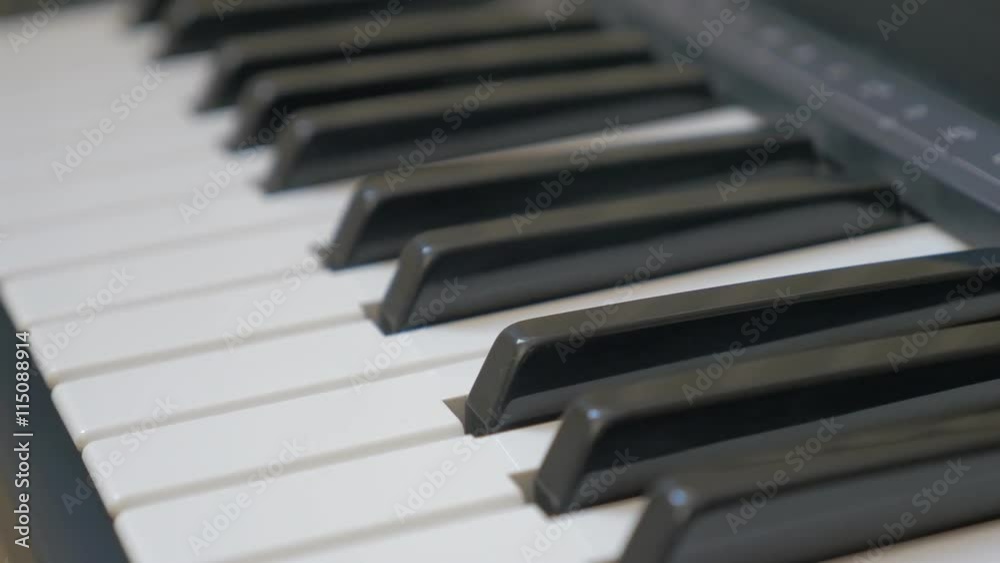 Electric piano keys close-up panning 4K 2160p UHD footage - Electric piano black and white keyboard 4K 3840X2160 panning UHD video Electric piano keys close-up panning 4K 2160p UHD footage - Electric piano black and white keyboard 4K 3840X2160 panning UHD video