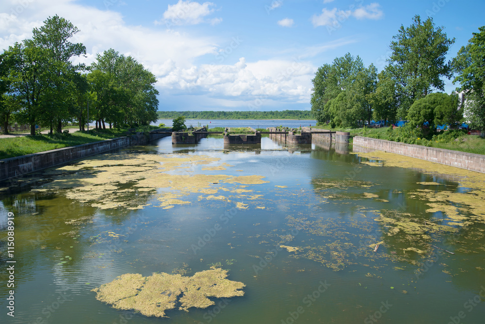 View of the ruins of an ancient gateway at the entrance to the old Ladoga canal, sunny june day Shlisselburg, Leningrad region, Russia