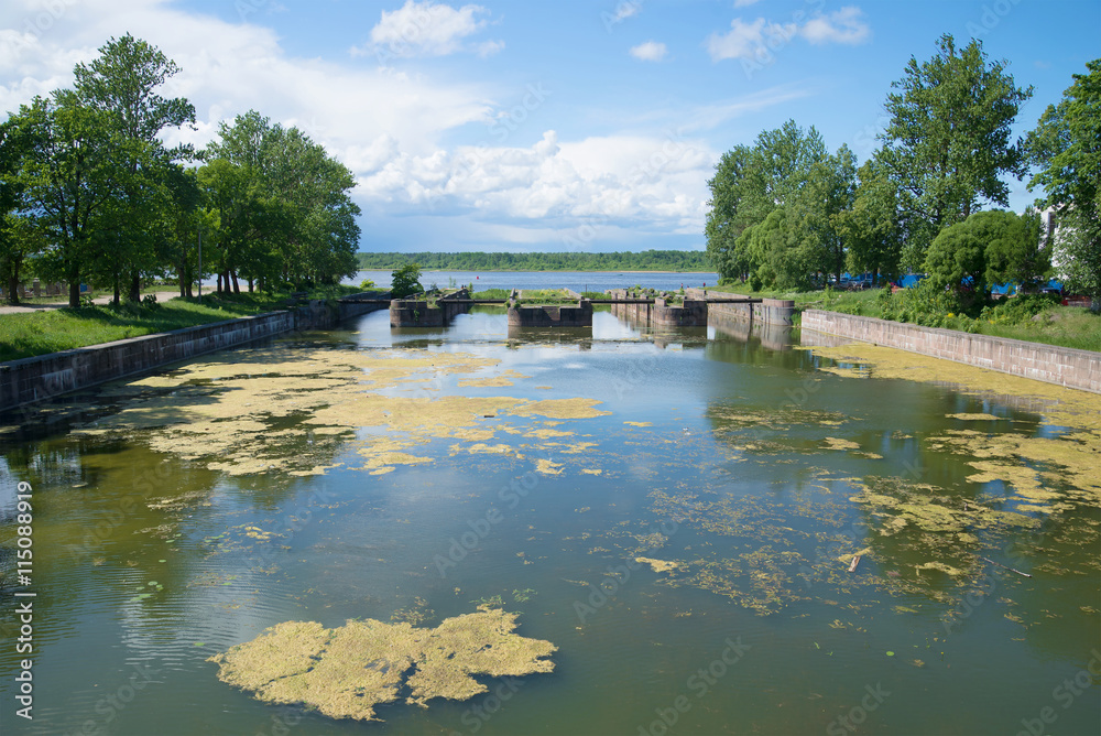 View of the ruins of an ancient gateway at the entrance to the old Ladoga canal, sunny june day Shlisselburg, Leningrad region, Russia View of the ruins of an ancient gateway at the entrance to the old Ladoga canal, sunny june day Shlisselburg, Leningrad region, Russia