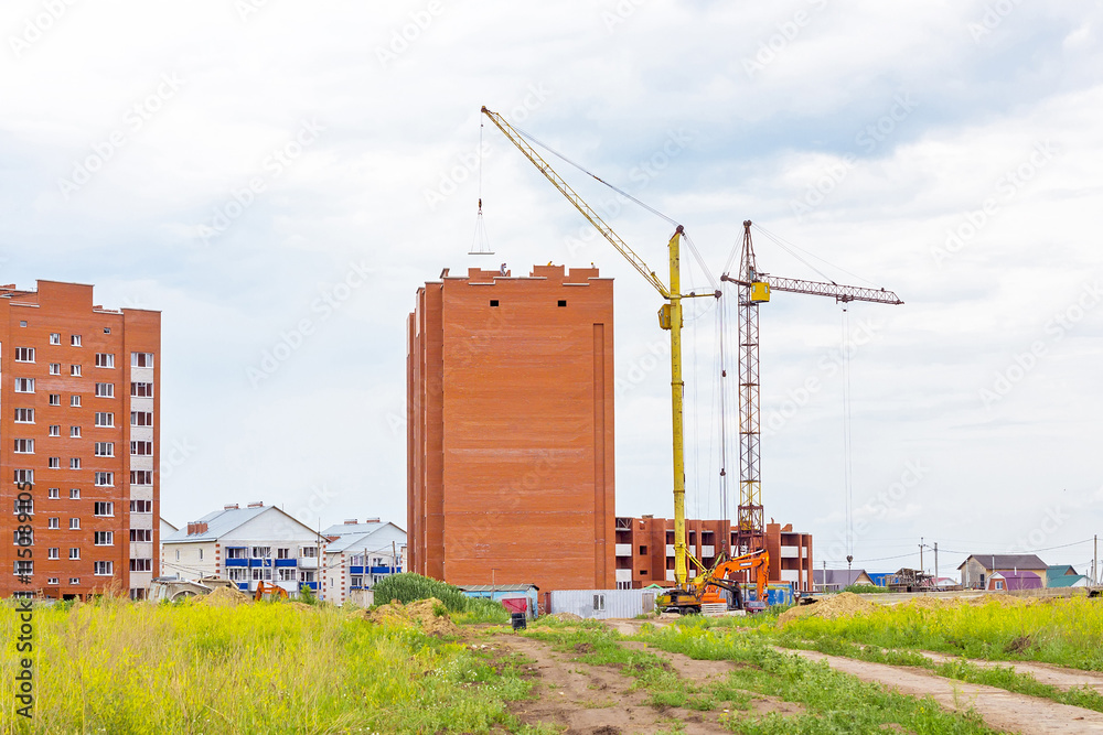 Construction of apartment houses of brick at the edge of town